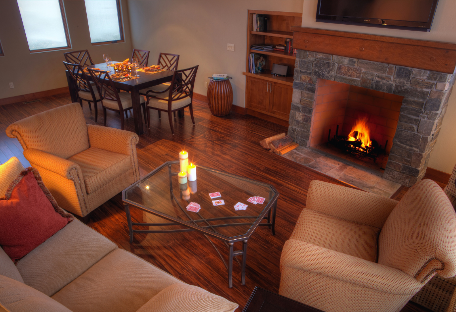 cozy living room with fireplace and warm hardwood flooring